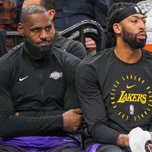 Los Angeles Lakers forward LeBron James (23) and forward Anthony Davis (3) on the bench against the Minnesota Timberwolves in the fourth quarter at Target Center