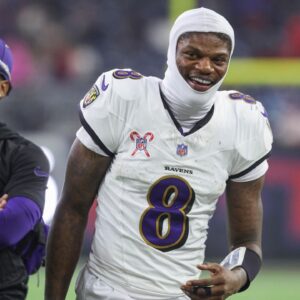 Baltimore Ravens quarterback Lamar Jackson (8) smiles during the fourth quarter against the Houston Texans at NRG Stadium.