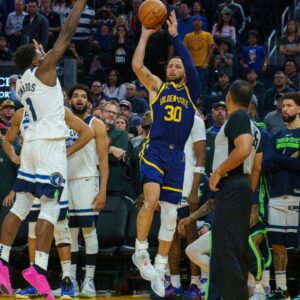 Golden State Warriors guard Stephen Curry (30) attempts to tie the game with a three point shot with two seconds left in the game against Minnesota Timberwolves guard Anthony Edwards (1) during the fourth quarter at Chase Center