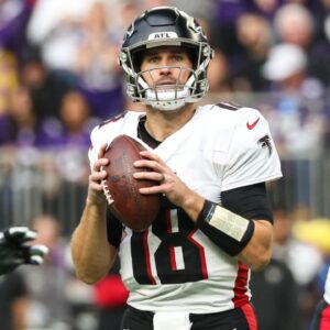 Dec 8, 2024; Minneapolis, Minnesota, USA; Atlanta Falcons quarterback Kirk Cousins (18) looks to throw against the Minnesota Vikings during the first quarter at U.S. Bank Stadium.