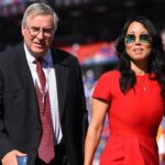 Buffalo Bills owners Terry and Kim Pegula walk on the field prior to the game against the Miami Dolphins at New Era Field.