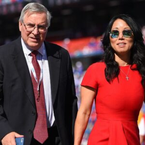 Buffalo Bills owners Terry and Kim Pegula walk on the field prior to the game against the Miami Dolphins at New Era Field.