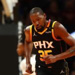 Phoenix Suns forward Kevin Durant (35) against the San Antonio Spurs in the first half of an NBA Cup game at Footprint Center