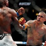 Alex Pereira (red gloves) fights Khalil Rountree Jr. (blue gloves) in a light heavyweight title bout during UFC 307 at Delta Center.