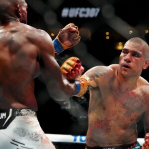 Alex Pereira (red gloves) fights Khalil Rountree Jr. (blue gloves) in a light heavyweight title bout during UFC 307 at Delta Center.