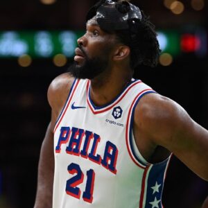 Philadelphia 76ers center Joel Embiid (21) waits during a timeout during the second half against the Boston Celtics at TD Garden.