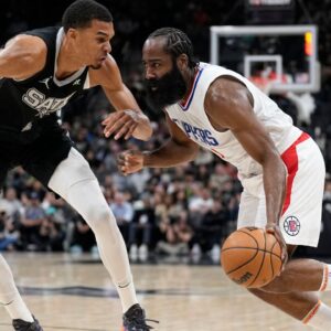 Los Angeles Clippers guard James Harden (1) drives to the basket against San Antonio Spurs forward Victor Wembanyama (1) during the first half at Frost Bank Center.