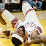 Phoenix Suns forward Ryan Dunn (0) reacts with an apparent injury against the Golden State Warriors during the second quarter at Chase Center.
