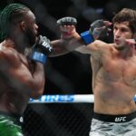 Movsar Evloev (red gloves) fights Aljamain Streling (blue gloves) at T-Mobile Arena.