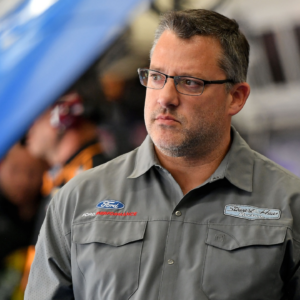 NASCAR Cup Series car owner Tony Stewart looks on in the garage during practice for the Coca-cola 600 at Charlotte Motor Speedway.