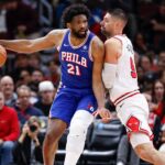 Chicago Bulls center Nikola Vucevic (9) defends against Philadelphia 76ers center Joel Embiid (21) during the first half at United Center.