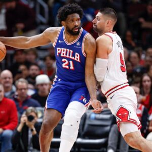 Chicago Bulls center Nikola Vucevic (9) defends against Philadelphia 76ers center Joel Embiid (21) during the first half at United Center.