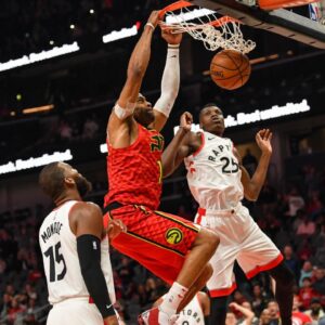 Atlanta Hawks forward Vince Carter (15) scores his 25,000 point in the NBA on a dunk on the final play of the game against the Toronto Raptors during the second half at State Farm Arena