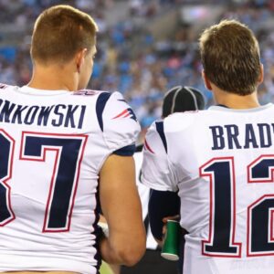 Aug 24, 2018; Charlotte, NC, USA; New England Patriots tight end Rob Gronkowski (87) talks with quarterback Tom Brady (12) during the fourth quarter against the Carolina Panthers at Bank of America Stadium.