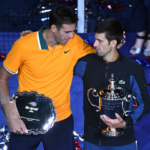 Juan Martin Del Potro of Argentina and Novak Djokovic of Serbia poses with the runner-up and championship trophies (respectively) on day fourteen of the 2018 U.S. Open tennis tournament
