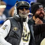 Nov 23, 2024; Kansas City, Missouri, USA; Colorado head coach Deion Sanders watches the run of play during the 3rd quarter between the Kansas Jayhawks and the Colorado Buffaloes at GEHA Field at Arrowhead Stadium.