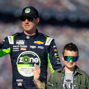 Feb 19, 2024; Daytona Beach, Florida, USA; NASCAR Cup Series driver Kyle Busch with son Brexton Busch during the Daytona 500 at Daytona International Speedway. Mandatory Credit: Mark J. Rebilas-Imagn Images