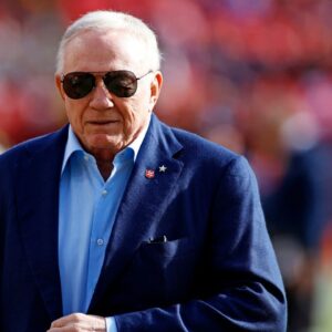 Dallas Cowboys owner Jerry Jones walks off the field before the game between the Washington Commanders and the Dallas Cowboys at Northwest Stadium.