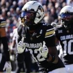 Nov 29, 2024; Boulder, Colorado, USA; Colorado Buffaloes wide receiver Travis Hunter (12) dances following his third quarter touchdown reception against the Oklahoma State Cowboys at Folsom Field.