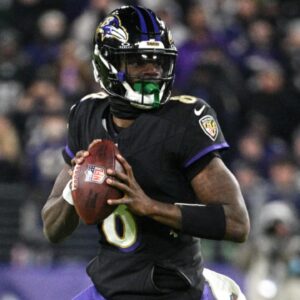 Dec 1, 2024; Baltimore, Maryland, USA;Baltimore Ravens quarterback Lamar Jackson (8) looks to pass during the first half against the Philadelphia Eagles at M&T Bank Stadium.