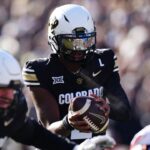Nov 29, 2024; Boulder, Colorado, USA; Colorado Buffaloes quarterback Shedeur Sanders (2) takes a hike in the first quarter against the Oklahoma State Cowboys at Folsom Field.