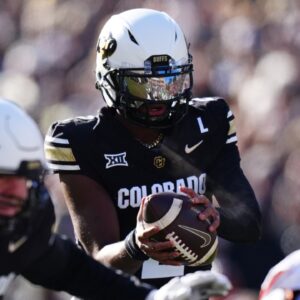 Nov 29, 2024; Boulder, Colorado, USA; Colorado Buffaloes quarterback Shedeur Sanders (2) takes a hike in the first quarter against the Oklahoma State Cowboys at Folsom Field.