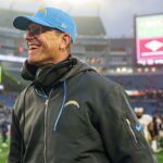 Los Angeles Chargers head coach Jim Harbaugh reacts after defeating the New England Patriots at Gillette Stadium.