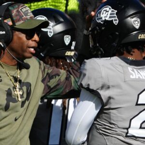 Nov 11, 2023; Boulder, Colorado, USA; Colorado Buffaloes quarterback Shedeur Sanders (2) celebrates his touchdown with head coach Deion Sanders in the first half against the Arizona Wildcats at Folsom Field.