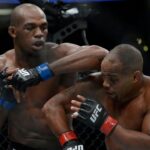 Jon Jones lands an elbow hit as Daniel Cormier defends during UFC 214 at Honda Center.