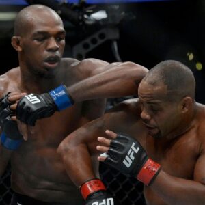 Jon Jones lands an elbow hit as Daniel Cormier defends during UFC 214 at Honda Center.