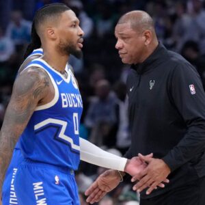 Milwaukee Bucks head coach Doc Rivers congratulates Milwaukee Bucks guard Damian Lillard (0) in the second half at Fiserv Forum.