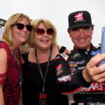 Monster Energy NASCAR Cup Series driver Clint Bowyer (right) poses for a selfie with fans during qualifying for the Alabama 500 at Talladega Superspeedway.