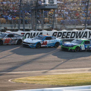 NASCAR Cup Series driver Noah Gragson (10), Todd Gilliland (38) and driver Kyle Busch (8) race three wide during the Iowa Corn 350 at Iowa Speedway.