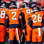 Nov 17, 2024; Denver, Colorado, USA; Members of the Denver Broncos defensive team huddle in the first quarter against the Atlanta Falcons at Empower Field at Mile High.