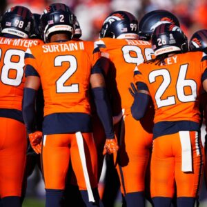 Nov 17, 2024; Denver, Colorado, USA; Members of the Denver Broncos defensive team huddle in the first quarter against the Atlanta Falcons at Empower Field at Mile High.