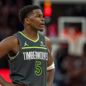 Minnesota Timberwolves guard Anthony Edwards (5) looks on against the Golden State Warriors in the second half at Target Center.
