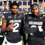 Colorado Buffaloes quarterback Shedeur Sanders (2) and safety Shilo Sanders (21) before the game against the Oklahoma State Cowboys at Folsom Field.