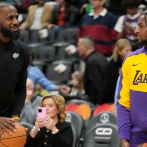 Los Angeles Lakers forward LeBron James (left) and guard Bronny James (right) during warm up before a game agaonst the Toronto Raptors at Scotiabank Arena.