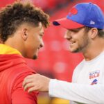 Kansas City Chiefs quarterback Patrick Mahomes (15) talks with Buffalo Bills quarterback Josh Allen (17) before warm ups at GEHA Field at Arrowhead Stadium.
