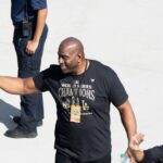 Los Angeles Dodgers minority owner and former Los Angeles Laker Magic Johnson arrives at Dodger Stadium for the team’s World Series Championship celebration on Nov. 1, 2024.