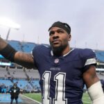 Dallas Cowboys linebacker Micah Parsons (11) walks off the field after the game at Bank of America Stadium.