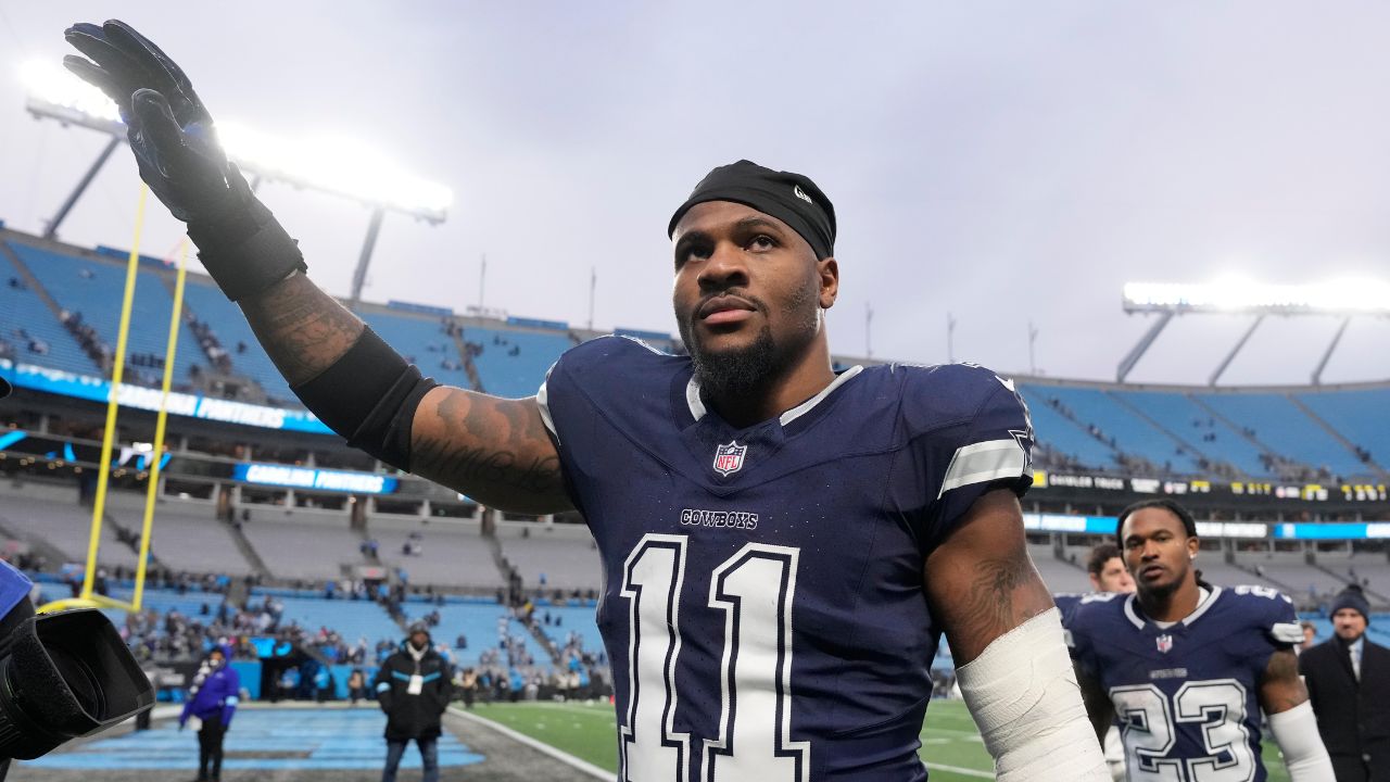 Dallas Cowboys linebacker Micah Parsons (11) walks off the field after the game at Bank of America Stadium.