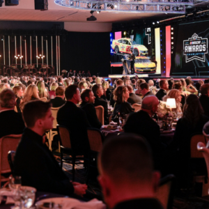 NASCAR Cup Series driver Joey Logano (22) talks to the audience during the NASCAR Awards Banquet at Charlotte Convention Center.