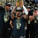 Milwaukee Bucks forward Giannis Antetokounmpo (34), guard Damian Lillard (0) and center Brook Lopez (11) celebrate after winning the Emirates NBA Cup championship game against the Oklahoma City Thunder at T-Mobile Arena.