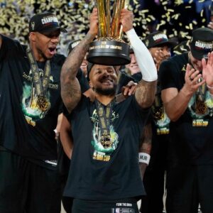 Milwaukee Bucks forward Giannis Antetokounmpo (34), guard Damian Lillard (0) and center Brook Lopez (11) celebrate after winning the Emirates NBA Cup championship game against the Oklahoma City Thunder at T-Mobile Arena.