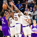 Utah Jazz guard Collin Sexton (2) gets blocked by Los Angeles Lakers forward LeBron James (23), forward/center Anthony Davis (3), and center Christian Koloko (10) in the final second of the second half at the Delta Center.