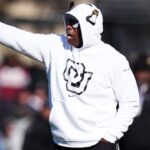 Nov 29, 2024; Boulder, Colorado, USA; Colorado Buffaloes head coach Deion Sanders calls out in the second quarter against the Oklahoma State Cowboys at Folsom Field.