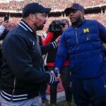 Ohio State Buckeyes head coach Ryan Day shakes hands with Michigan Wolverines head coach Sherrone Moore following the NCAA football game at Ohio Stadium in Columbus on Saturday, Nov. 30, 2024. Michigan won 13-10.