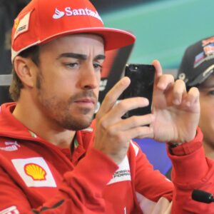 Nov. 15, 2012 - Austin, Texas, USA - Formula 1 driver FERNANDO ALONSO (left) of Spain takes pictures of the media during a press conference at the Circuit of the America s in Austin, Texas