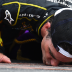 NASCAR Sprint Cup Series driver Jeff Gordon (24) kisses the brick after winning the Crown Royal Brickyard 400 at Indianapolis Motor Speedway.